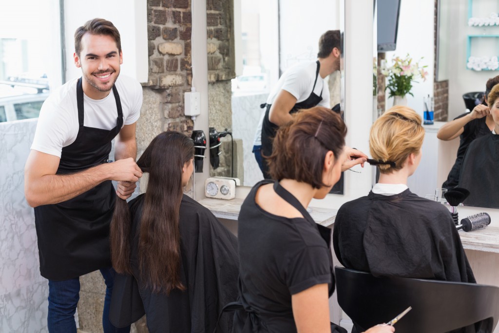 Hairdressers working on their clients